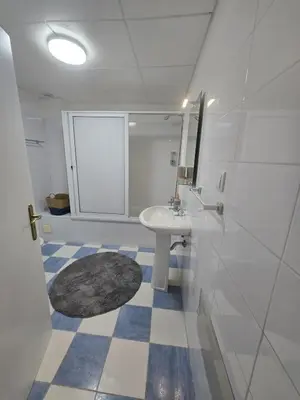 a bathroom with a sink and a mirror at The Empress Atlantic Stay Free Parking in Funchal