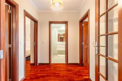 an empty hallway with two doors and a room with a door at Suite Vista Mar in Funchal
