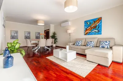 a living room with a couch and a table at Suite Vista Mar in Funchal