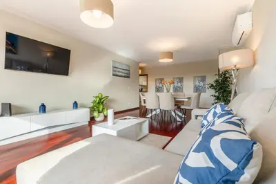 a living room with a couch and a table at Suite Vista Mar in Funchal