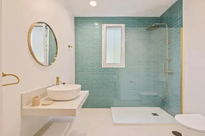 a bathroom with a white sink and a mirror at Villa Rosa Mare by Homie in Seixal
