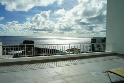 a balcony with a view of the ocean at Harbour View Apartment Free Parking in Funchal