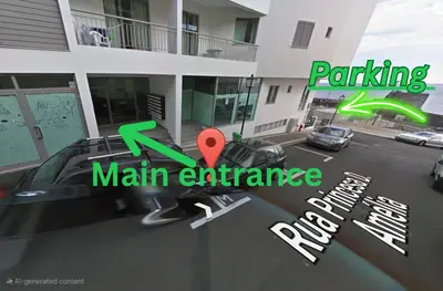 a view of a parking main entrance of a building at Harbour View Apartment Free Parking in Funchal