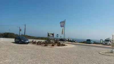 a car parked on the side of a road at Beach front apartment 1 in Sagres