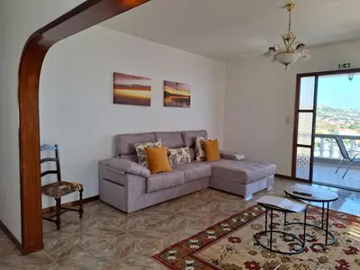a living room with a couch and a table at Casa Figo- Calheta in Calheta