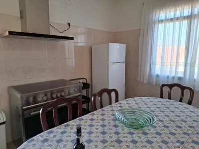 a kitchen with a table with a plate on it at Casa Figo- Calheta in Calheta