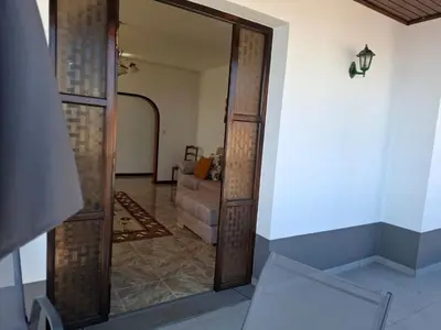 a door leading into a living room with a couch at Casa Figo- Calheta in Calheta