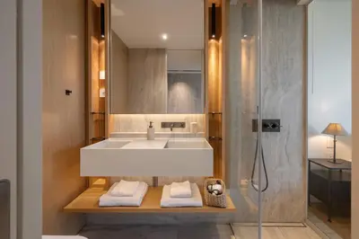 a bathroom with a sink and a shower at Savoy Monumentalis IX by An Island Apart in Funchal