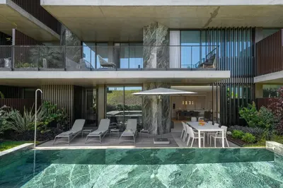 an external view of a house with a swimming pool at Savoy Monumentalis IX by An Island Apart in Funchal