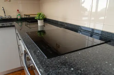 a kitchen with a counter top with a laptop on it at Vista al Mar in Ribeira Brava