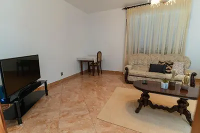 a living room with a couch and a table at Vista al Mar in Ribeira Brava