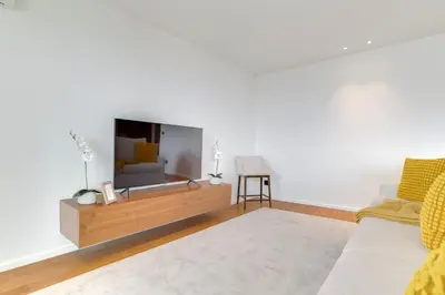 a living room with a tv and a couch at OceanView Pearl Varino by Holiday Rental Madeira in Funchal