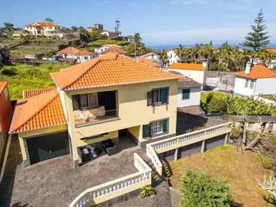 an aerial view of a house with an orange roof at Villa Serrão, By OP in Ponta Delgada