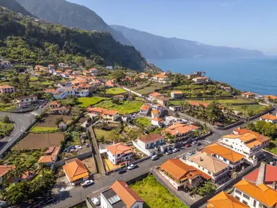 an aerial view of a town next to the ocean at Villa Serrão, By OP in Ponta Delgada