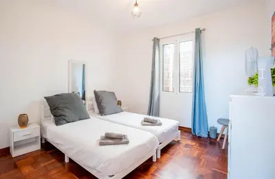 a bedroom with two beds in a room at Mill House in Ponta do Sol