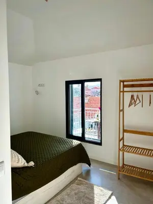 a bedroom with a bed and a window at Casa Happy in Funchal