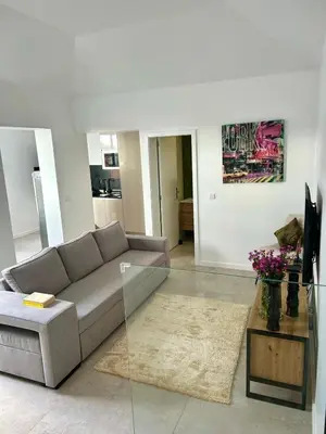 a living room with a couch and a table at Casa Happy in Funchal