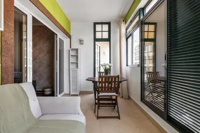 a living room with a couch and a table at Doca's Refuge by Homie in Funchal