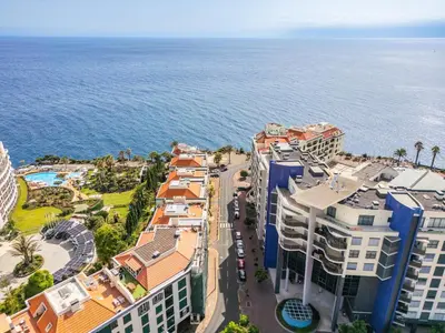 an aerial view of buildings and the ocean at Doca's Refuge by Homie in Funchal
