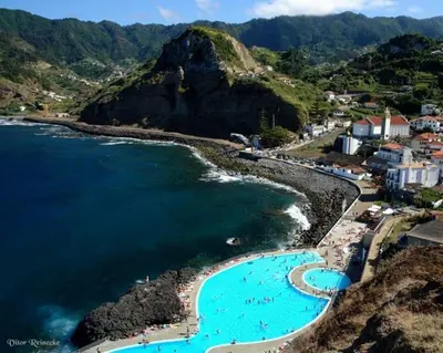 an aerial view of a beach and the ocean at Maresia Gardens in Porto da Cruz