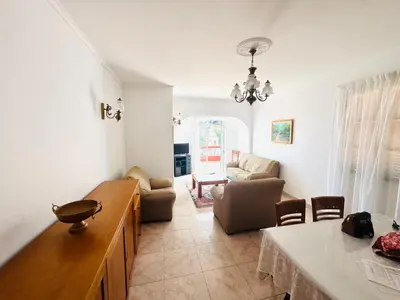 a living room with a couch and a table at Casa da Rochinha in Santa Cruz