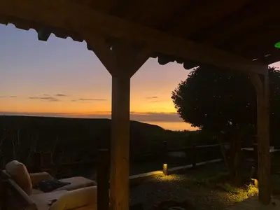 a view of the sunset from a gazebo at CasaDaMeiaLuaArrifana in Aljezur