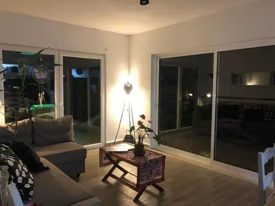 a living room with a couch and a table at CasaDaMeiaLuaArrifana in Aljezur