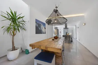 a white room with a desk and a computer at Casa Surfer’s Sanctuary - Algarve in Vila do Bispo