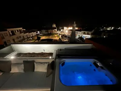 a view from the back of a boat at night at Casa Surfer’s Sanctuary - Algarve in Vila do Bispo