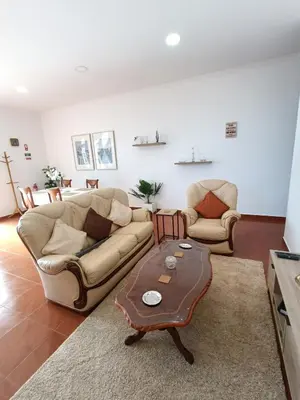 a living room with a couch and a coffee table at my flower in Ponta do Sol