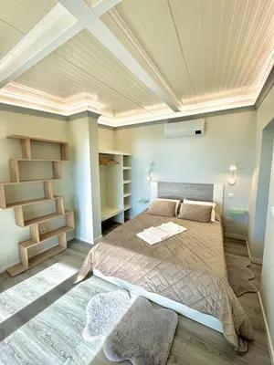 a bedroom with a bed and a coffered ceiling at Hera House, Ponta do Sol, Portugal in Canhas