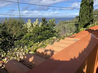 a set of stairs with a view of the ocean at Casadarvore in Ponta Delgada