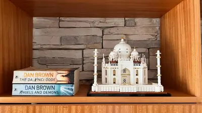a building toy on a shelf next to books at Forum Palace Madeira in Funchal