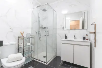 a bathroom with a shower and a toilet and a sink at Casa dos Vinhos by Atlantic Holiday in Santa Maria Maior