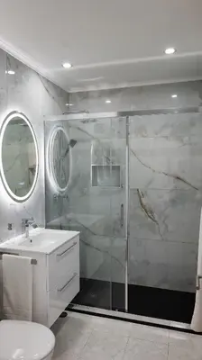 a bathroom with a shower and a toilet and a sink at Residential Camacho, By OP in Funchal