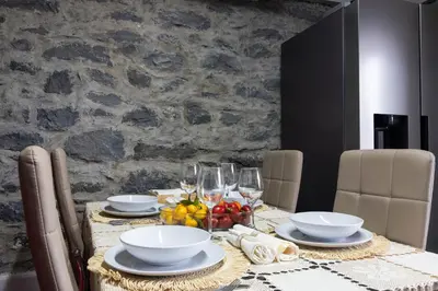 a dining room table with plates and glasses on it at Valley Canhas I in Canhas