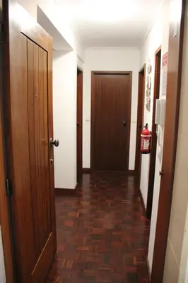 a hallway with two doors and a hallwayngth at A Casa da Dúlia in Funchal