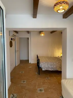 a room with a bed in the middle of a room at Sunny Aljezur da Misericórdia, Aljezur, Costa Vicentina in Aljezur