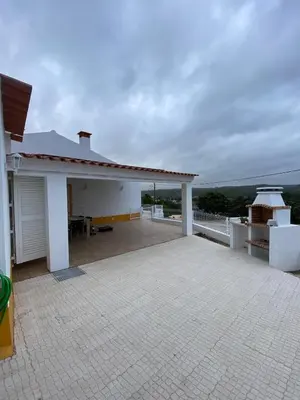 a white house with a roof with a patio at Sunny Aljezur da Misericórdia, Aljezur, Costa Vicentina in Aljezur