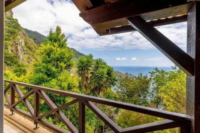 a view of the ocean from the balcony of a house at Casa do Jardim Botanico in Faial