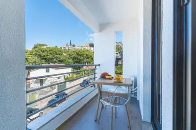 a balcony with a table and a view at Pena View Apartment by Atlantic Holiday in Funchal