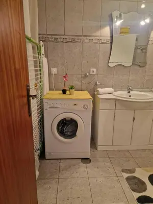 a bathroom with a washing machine and a sink at Pico Ferreira by MTH in Tábua