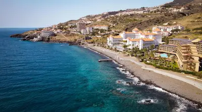 an aerial view of a beach with buildings and the ocean at Breeze House 1 by Atlantic Holiday in Caniço