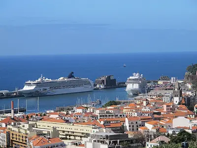 a city with two cruise ships in the water at Capuchinhas Apartment in Funchal