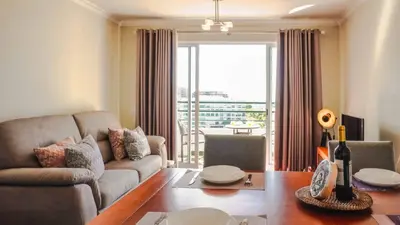 an aerial view of a large building on a hill at Like Home VI Praia Formosa I Sea View Balcony I Free Parking in Funchal