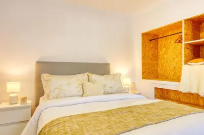 a bedroom with a bed and a window at Casa da Tia Celeste II, a Home in Madeira in Ponta do Sol