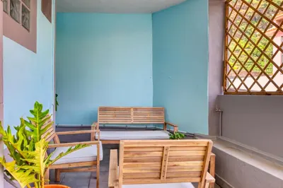 a room with two chairs and a table and a window at Casa da Tia Celeste II, a Home in Madeira in Ponta do Sol