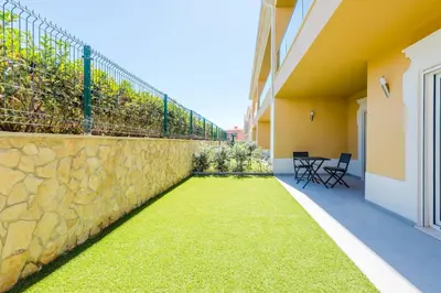 a retaining wall with grass on the side of a building at Boavista Golf and Spa Resort - Bayview Bellavista in Lagos