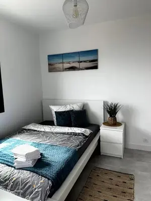 a bedroom with a bed with a metal frame at CoLiving Funchal in Funchal