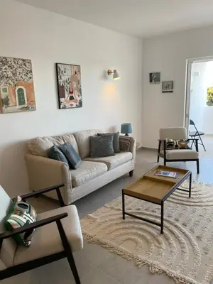 a living room with a couch and a coffee table at The Ocean View Luz in Luz